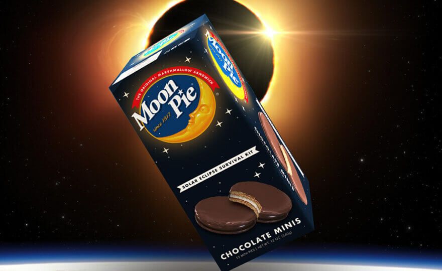 A box of Moon Pie snacks in front of a solar eclipse